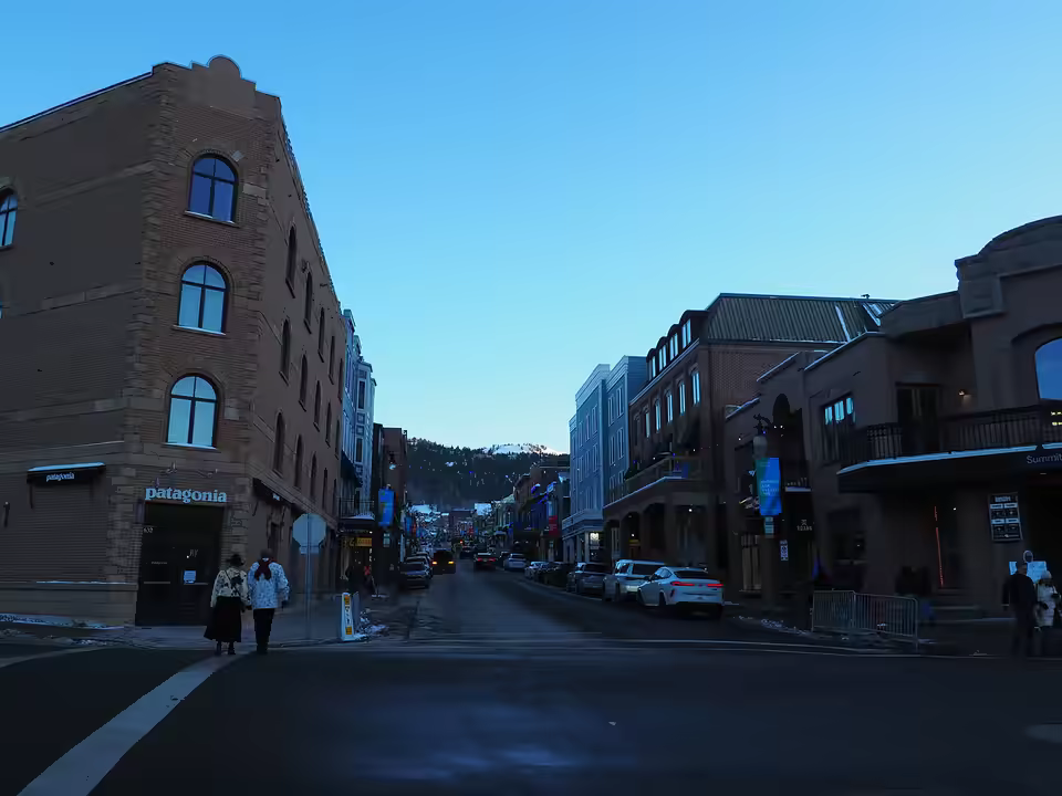 Main Street in Park City after a snow, with the town lift on the ridge.