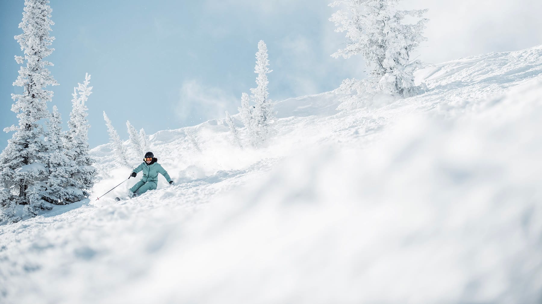 Skiers on a groomed run at Deer Valley